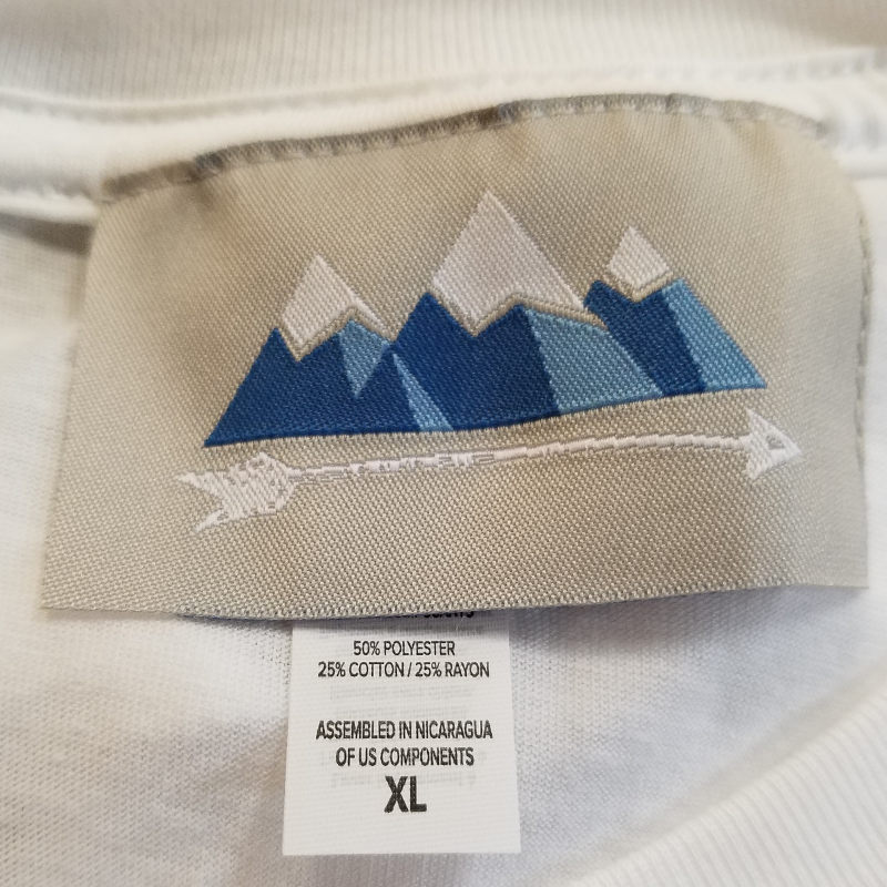 picture of woven label sewn in neck of t shirt