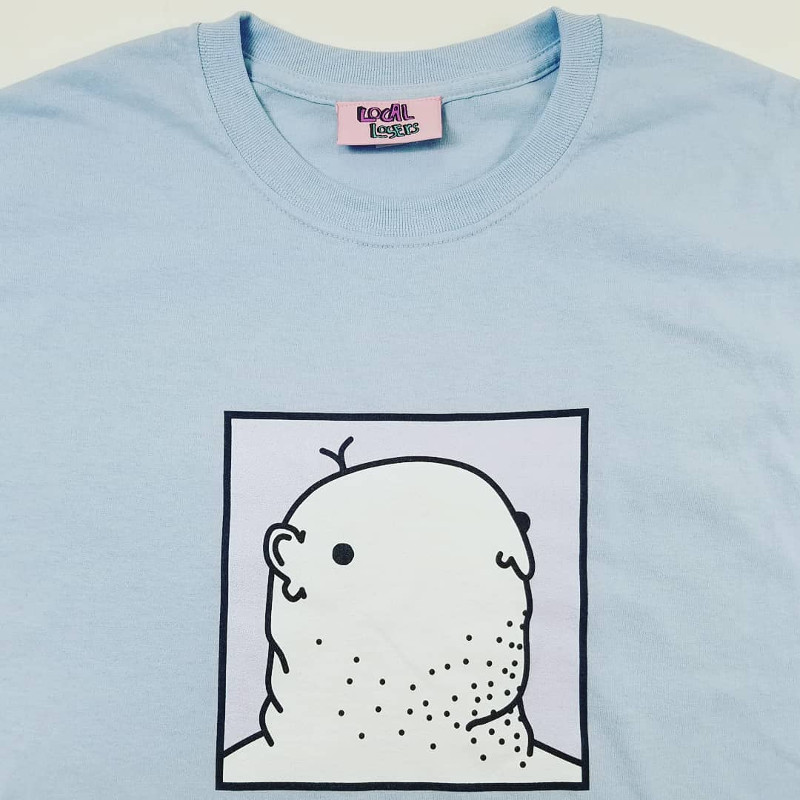 picture of woven label sewn in neck of t shirt